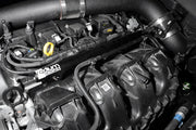 Close-up of a car engine with 'Radium' branding on a black background