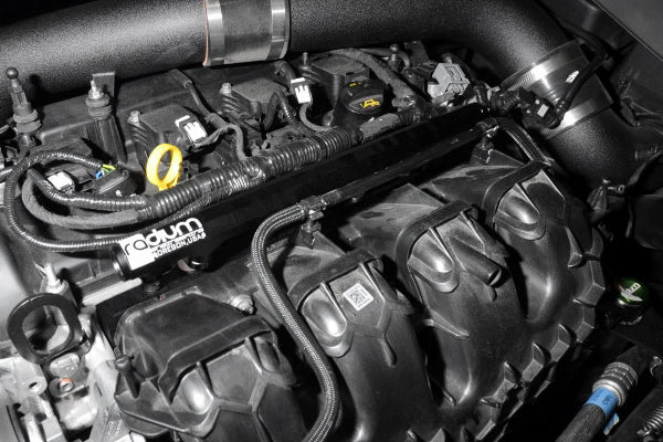 Close-up of a car engine with 'Radium' branding on a black background